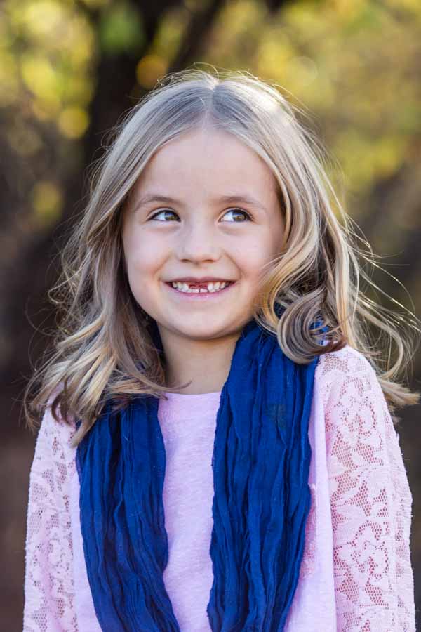 Littleton family and child photographer in Colorado cute girl with missing teeth
