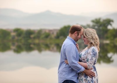 Littleton family photographer couples in love lake summer couple Colorado golden hour sunset forehead snuggles married marriage