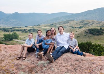 Littleton family photographer South Valley Open Space park Ken Caryl red rocks rock formations Colorado foothills photography mountain view adoption kids children boys girls