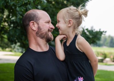 Littleton family photographer father daughter little girl noses nose Denver photography sweet