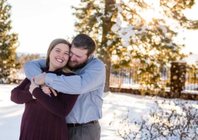 Littleton engagement photographer engaged couple in love Highlands Ranch Mansion Colorado foothills golden hour sunset light photography snuggle husband and wife to be snow winter esession