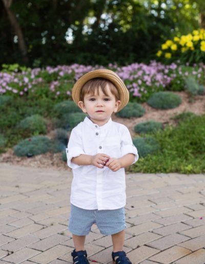 Littleton family photographer child children little boy with a cute hat summer flowers Highlands Ranch Mansion Colorado photography one year old milestone session brother