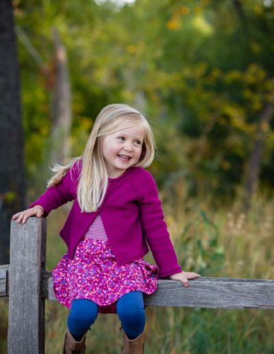 Littleton family photographer child kid Colorado fall little girl Prospect Park Arvada trail wooden fence