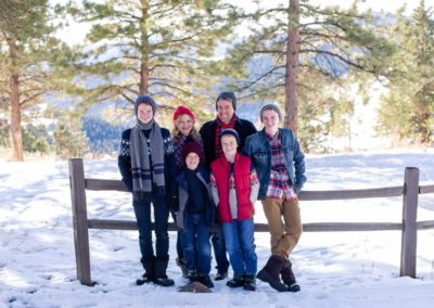 Littleton family teen photographer in Colorado snow mountains view winter wonderland hats boys brothers Mt. Falcon foothills fresh powder photography