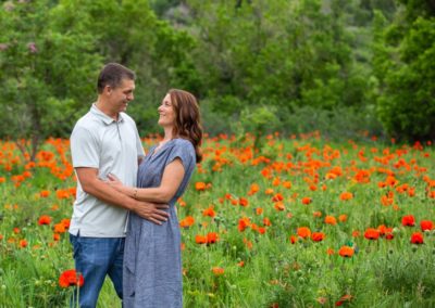 Littleton family photographer in Colorado Morrison poppy field couples in love married marriage husband and wife