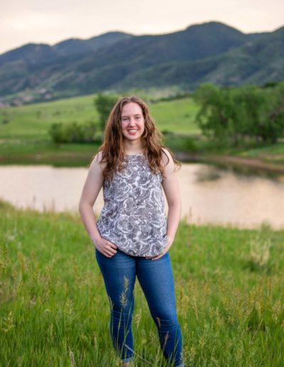 Littleton high school senior portrait photographer class of 2020 Arapahoe public Centennial South Valley open space Jefferson County water flowers volleyball player girl curly hair beautiful pretty college bound smart photography natural light summer yearbook photo session