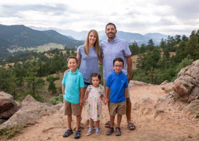 Littleton family photographer in Colorado at Mt. Falcon park foothills mountain view views boys girls sister brother sunset natural light photography