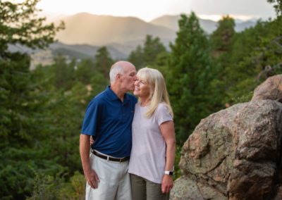 Littleton family photographer married couple in love anniversary marriage husband and wife Colorado mountains sunset view Mt. Falcon park natural light