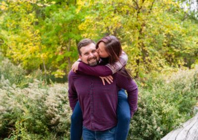 Littleton family photographer Fly'N B park Highlands Ranch Colorado CO in love couple couples fall leaves piggy back ride