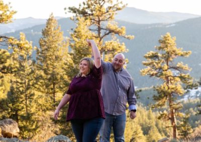 Littleton engagement photographer Mt. Falcon in love husband wife engaged mr. and mrs. mountains Colorado April wedding future marriage married diamond ring photography sunset twirl dancing