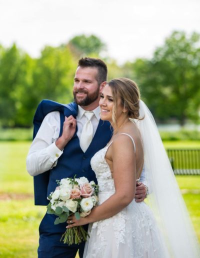 Littleton wedding photographer Catholic mass ceremony bride and groom married marriage dress bridesmaids groomsmen summer hot beautiful Wash Park dip veil priest Wellshire Event Center