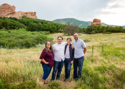 Littleton family photographer South Valley Open Space Park in Ken Caryl Colorado red rocks teens teenagers boys brother sunset light golden hour parents mother father summer