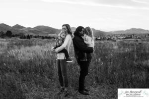 Littleton family photographer mini photo session Colorado sunset foothills kids brother sister mother father parenthood tall grasses fun moments photography