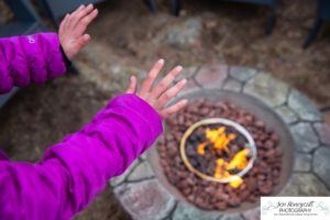 Littleton family photographer mountain camping views Evergreen firepit smores kids roasting marshmallows branding photo session outdoors tent ramble photography