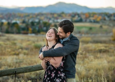 Littleton photographer couple engaged wedding engagement photo session Colorado foothills marriage in love wife husband future bride and groom fall sunset photography