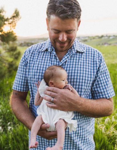 Littleton family and newborn baby photographer mini photo session sunset summer photography big brother little sister mother father son daughter infant cuddles snuggles sun flare kids