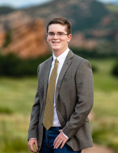 Littleton high school senior photographer South Valley red rocks suit boy Highlands Ranch photography